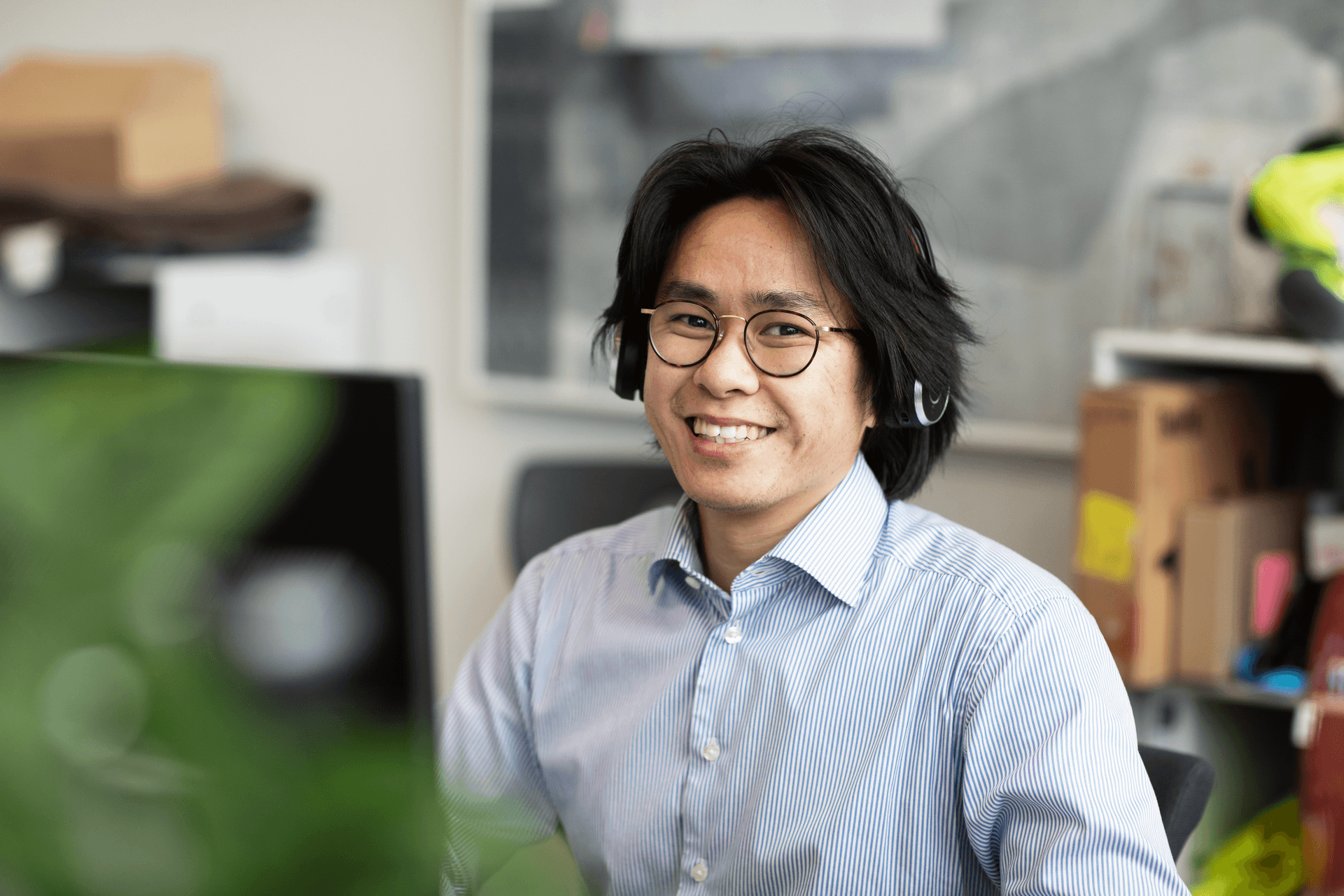 Smiling employee working at desk